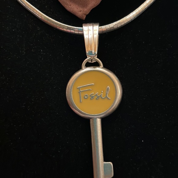 Fossil emblem re-purposed Sz 3.25 long 2 inches wide.  Yellow accent in middle. - Picture 6 of 8